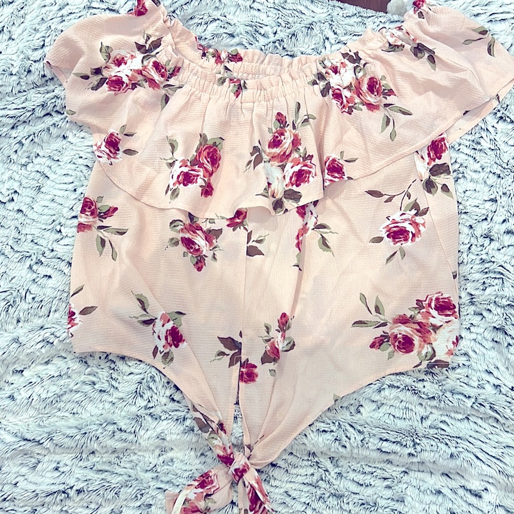 A sugar cute floral top from Love culture. It’s over the shoulder!